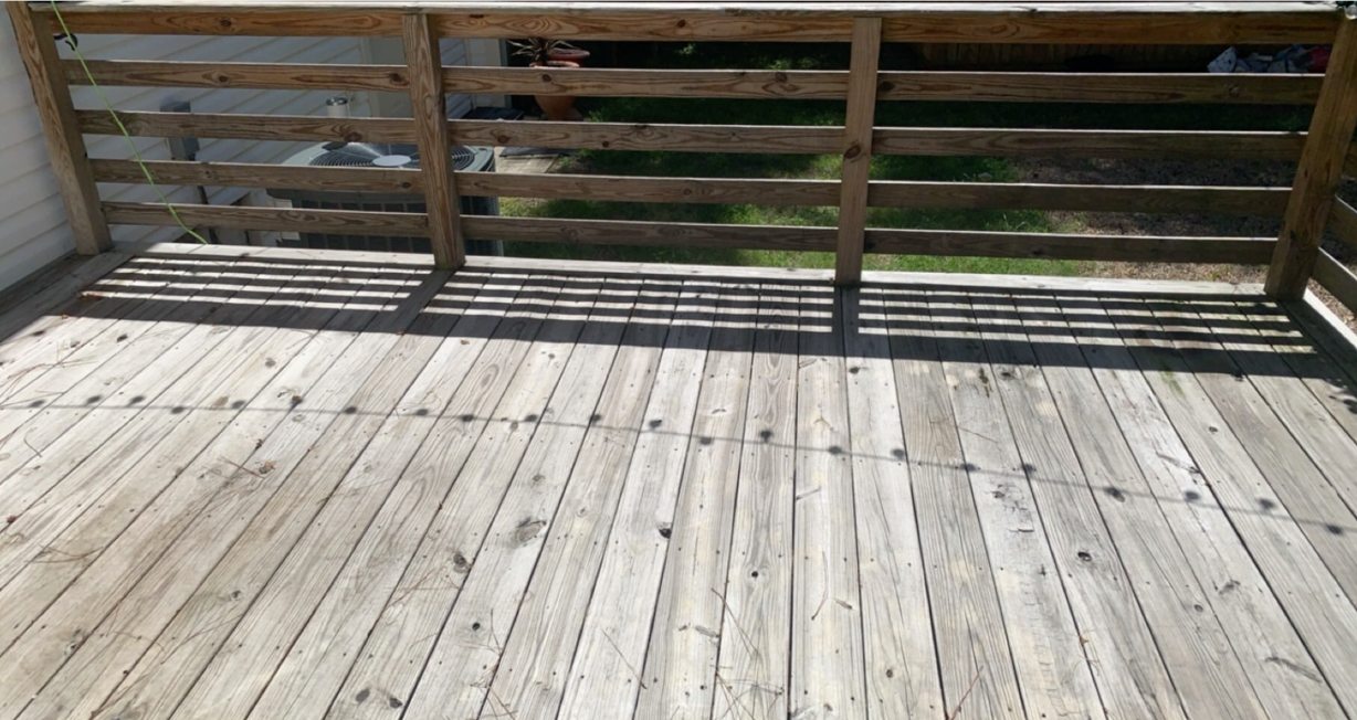 Before photo of weathered wood deck before cleaning and staining in Winder Georgia