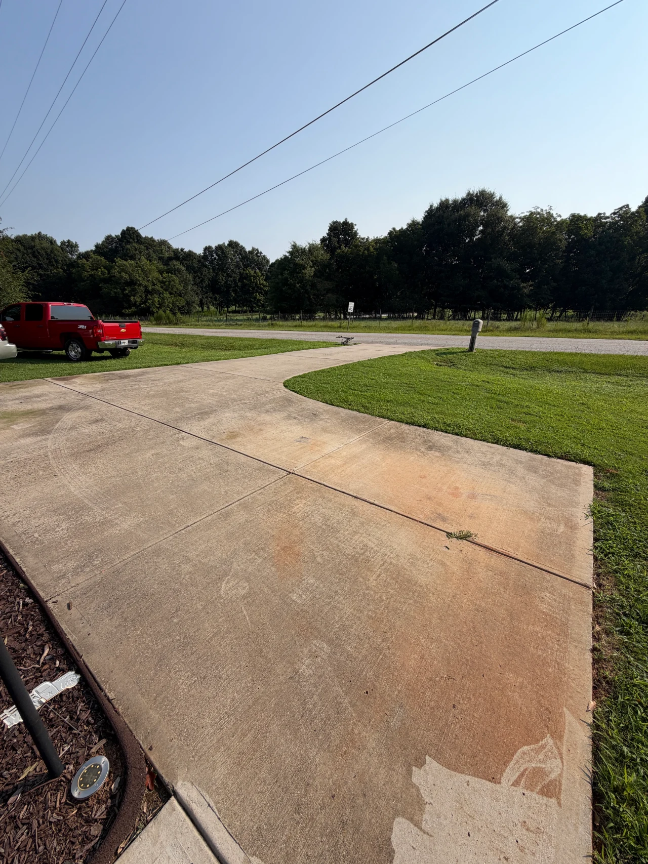 Concrete driveway and walkway outside a residential home