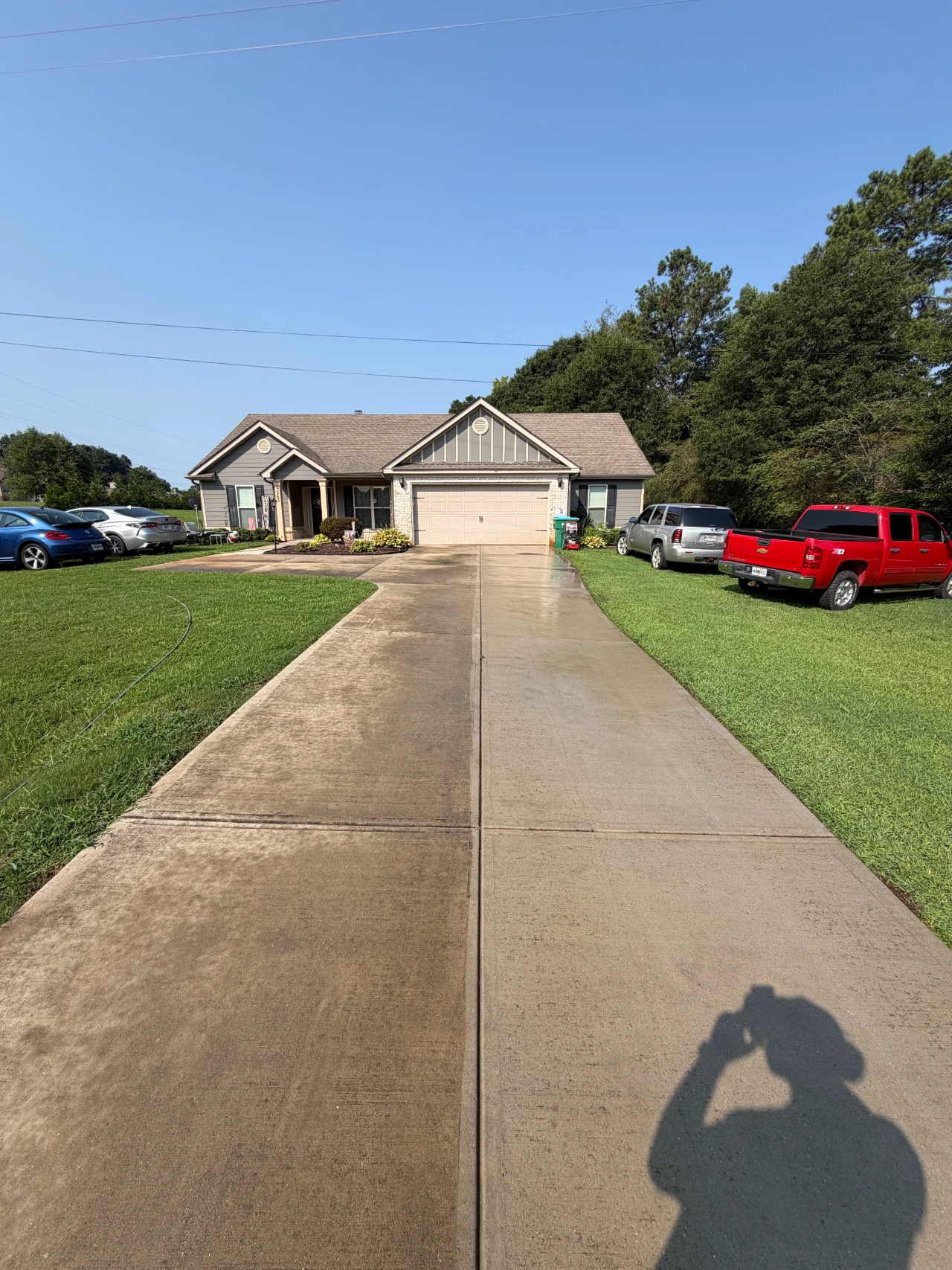 Concrete walkway leading from the street to a residential home